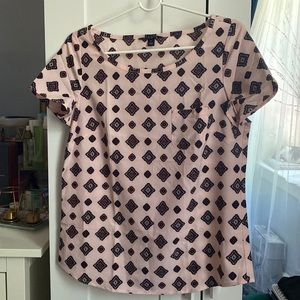 Short sleeve blouse, light pink with patterns. Size 6.